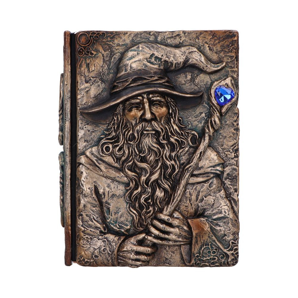 This Wizards Grimoire Journal is a magical, fantasy-themed notebook featuring a detailed resin wizard holding a staff topped with a vivid blue gem. Designed with a weathered, ancient look, it captures the feel of a true arcane relic. Packaged in a protective clear PVC box, it's ideal for gifting or display. Perfect for fantasy lovers, writers, gamers, and collectors, this journal is a unique place to conjure your thoughts and craft your mystical tales. Let your imagination awaken with a journal that feels pulled from the pages of legend.