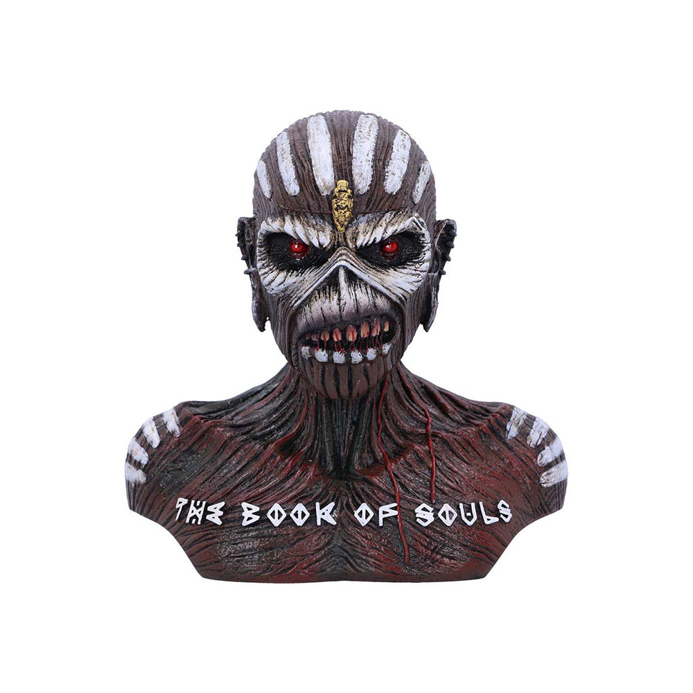 Officially Licensed Iron Maiden Book of Souls Small Bust Box: Show your allegiance to the Monsters of Rock with this electrifying and officially licensed Iron Maiden Book of Souls Small Bust Box. The zombie-like music icon stares forward with piercing red eyes, intimidating all those that pass by. The texture of the body is gnarled and unsettling to the touch, with deep creases and wrinkles covering the surface. Strings of coagulated blood stretch between his stained teeth, while two crimson droplets drip from the back of his elongated ear to the top of his chest. The iconic words 'The Book of Souls' stretch across the width of his chest, and at the very top his scalp can be removed to show a small storage space, perfect for keeping your most treasured trinkets safe. Cast in high-quality resin before being carefully hand-painted, this ideal piece of rock memorabilia will bring terror and excitement to any Maiden fan's soul!