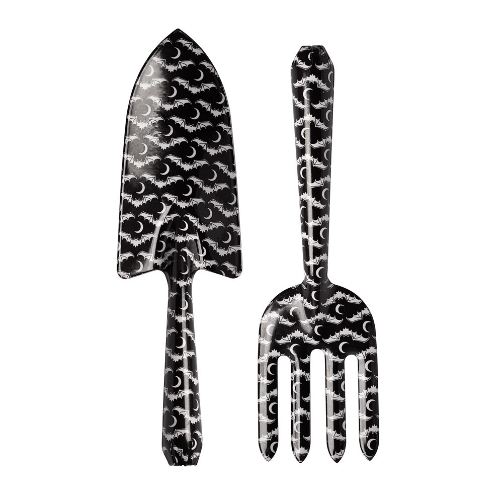 Unleash your dark green thumb with this Gothic Garden Gift Set from the original Alchemy Home & Gift collection. Featuring bat & moon artwork, this fork and trowel duo makes the perfect gift for gardeners, goths, and grave diggers alike.