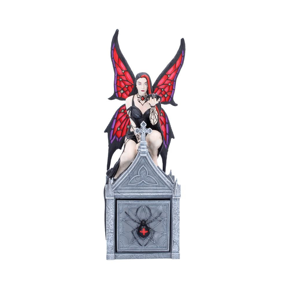 The Aracnafaria Box is a striking decorative piece from the dark imagination of alternative artist Anne Stokes, exclusively available from Nemesis Now. Featuring the instantly recognisable character Aracnafaria with red and black wings, black and red hair, and dramatic gothic spider styling. She crouches atop a tomb-like structure with a black widow spider resting within the palm of her hand. A removable box underneath her reveals a hidden compartment for storing treasured trinkets. Expertly hand-painted, this 20.6cm tall box is securely packaged within an originally designed gift box to protect its detailed finish. Perfect for fans of Anne Stokes and lovers of gothic or dark fantasy decor, this haunting trinket box adds a touch of mystery and elegance to any collection.