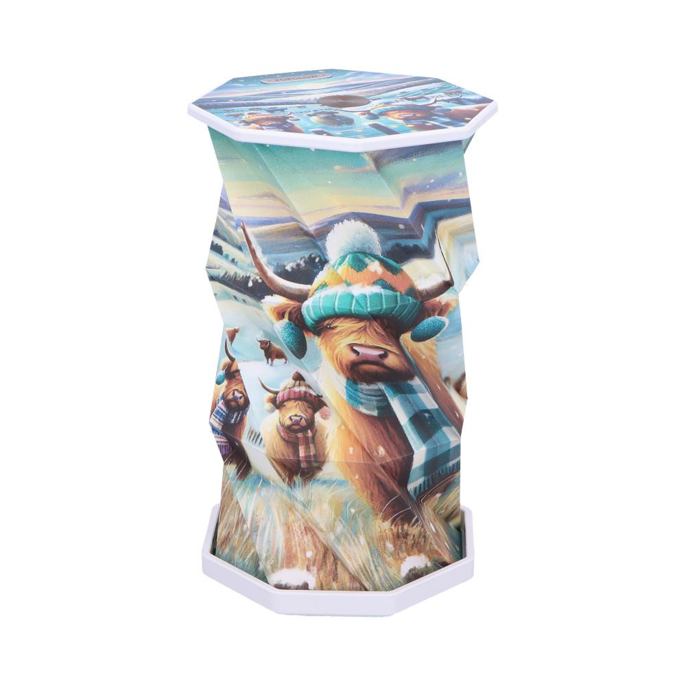 The Winter Highland Cows Foldable Lamp from Popglow is a charming and practical lighting piece that brings cosy countryside vibes to your home. Featuring whimsical winter Highland cow artwork, this foldable lamp is USB-C rechargeable, touch-activated, and includes dimmable LED lighting for wireless, customisable illumination. It comes beautifully packaged in a gift-ready box, making it perfect for holiday gifting or a seasonal décor refresh. Ideal for animal lovers, farmhouse décor fans, and anyone who enjoys warm, whimsical design, this lamp is a stylish way to light up your space with personality.