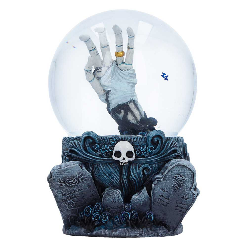 The Corpse Bride Snow Globe is an officially licensed collectible that captures the haunting elegance of Tim Burton's film. Inside the globe, Emily’s skeletal hand adorned with her ring, surrounded by swirling dark blue snowflakes. The base is beautifully detailed with blue swirls, delicate butterflies, and gravestones, all hand-painted and cast in fine resin. Packaged in a full colour branded box with protective inner packaging, it’s perfect for gifting or display. Ideal for fans of Corpse Bride, Tim Burton collectors, and lovers of gothic decor, this enchanting snow globe adds a touch of otherworldly romance to any collection.