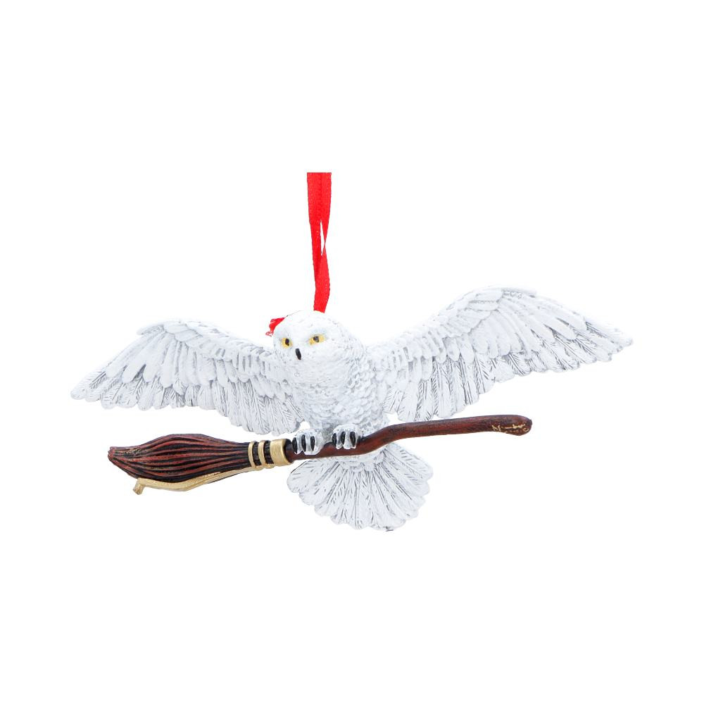 This Harry Potter Hedwig Broom Hanging Ornament is a beautifully crafted decor piece from Nemesis Now, depicting Hedwig mid-flight while carrying the Nimbus 2000. Cast in high-quality resin and hand-painted in film-accurate colours, it captures the owl’s graceful movement and intricate feather details. The ornament comes in a branded gift box, making it perfect for gifting or displaying at home. Ideal for Harry Potter fans, collectors of licensed merchandise, and lovers of magical decor, this enchanting piece brings a touch of wizarding-world charm and festive magic to any space.
