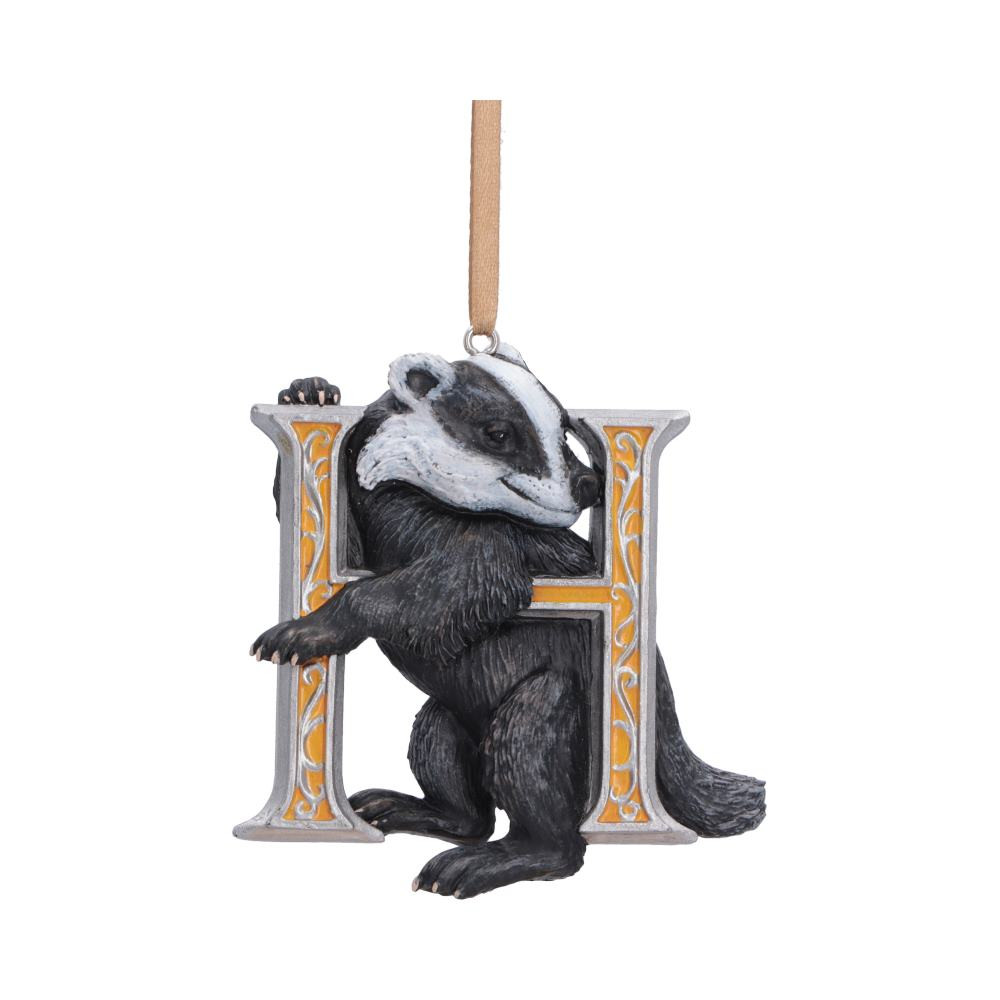 The Harry Potter Hufflepuff mascot hanging ornament is an officially licensed collectible from Nemesis Now, measuring at 7.7cm and celebrating the loyal and hardworking spirit of the Hufflepuff House. Featuring a yellow and silver letter ‘H’ with the iconic Hufflepuff badger resting within, it is expertly hand-painted and cast in the finest resin for a high-quality finish and fine detailing. Packaged in an officially licensed Harry Potter gift box and complete with a yellow ribbon for easy hanging and display, it is perfect for Harry Potter fans, Hufflepuff house members, collectors, and gift buyers alike. Bring a touch of warmth and Wizarding World charm into your home and proudly showcase the values of hard work, patience and loyalty with this beautifully crafted ornament.