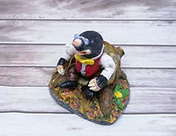 Mr Mole sat on tree stump