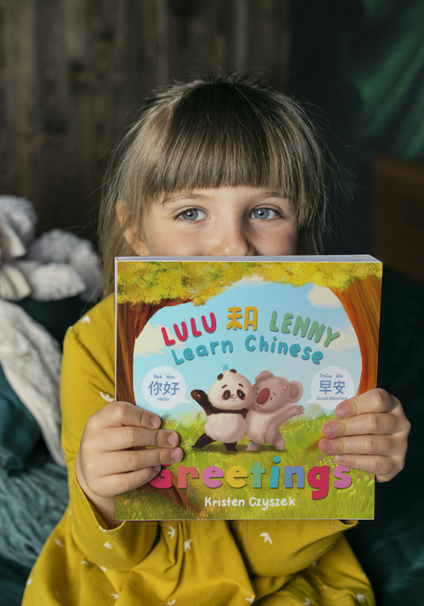 Square softcover book 7.5x7.5 in the hands of a little girl_Lulu and Lenny Learn Chinese G