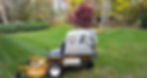Landscaping mower parked in freshly cut lawn