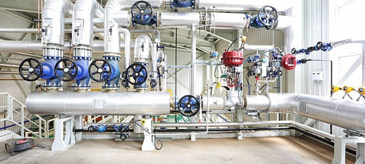 Piping and Instrumentation Diagrams (P&IDs) for high-pressure piping systems on the second floor of an oil and gas facility. The image shows a detailed schematic diagram with symbols representing pipes, valves, instrumentation, and control systems. The P&ID layout highlights the flow of fluids, pressure control, and the interconnection of equipment within the high-pressure system. It provides a clear visual representation of the system's design, essential for operational and safety monitoring in the industrial environment
