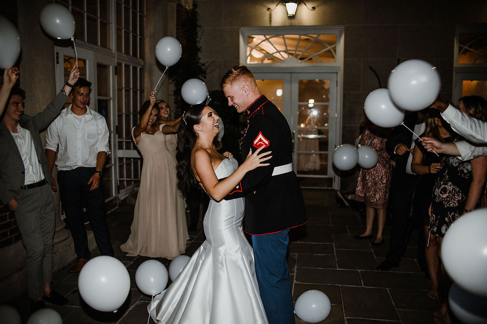 A wedding photographer and videographer team documenting a couple's special day.