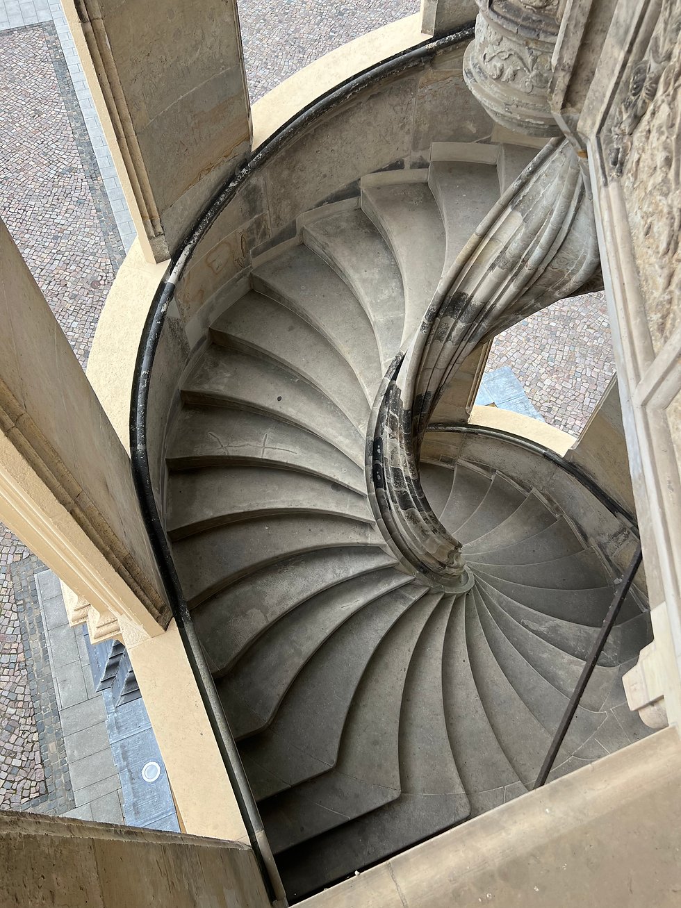 No central column, no attachment to the walls — just stone steps suspended in space.