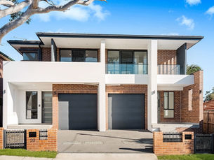 Newly completed custom duplex project by Betacon Construction showcasing modern architecture and landscaping.