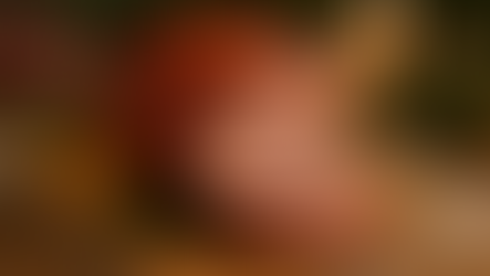 Glazed Christmas ham sliced on a serving board with festive decorations, Northern Beaches butcher presentation, Devitt Meats seasonal food image