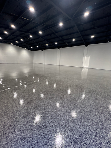 Heavy-duty epoxy flooring in industrial warehouse facility | Industrial Flooring Sydney | CrownCrete | Sydney