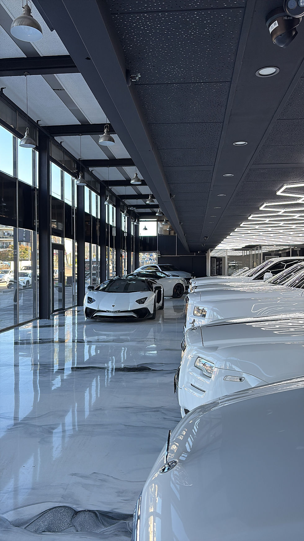 High-gloss metallic epoxy floor with marble effect finish | Metallic Epoxy Flooring Sydney | CrownCrete | Sydney