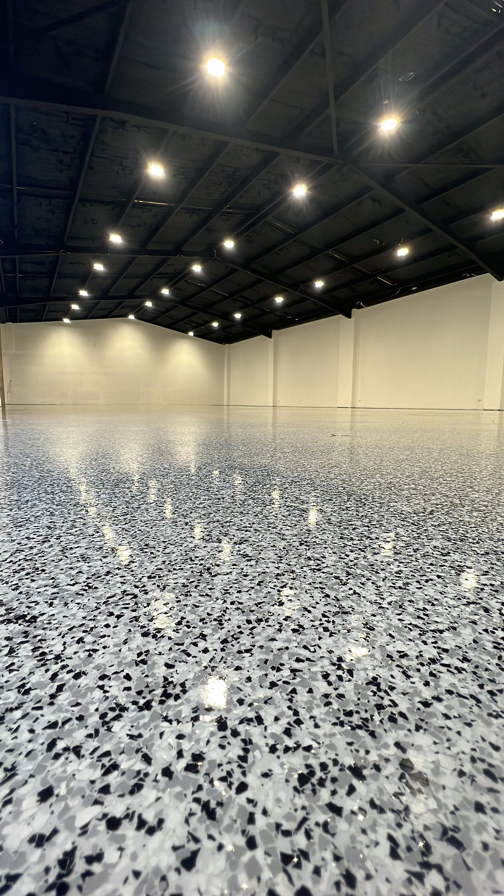 Heavy-duty epoxy flooring in industrial warehouse facility | Industrial Flooring Sydney | CrownCrete | Sydney