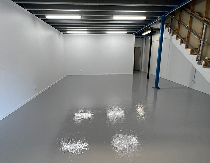 Heavy-duty epoxy flooring in industrial warehouse facility | Industrial Flooring Sydney | CrownCrete | Sydney