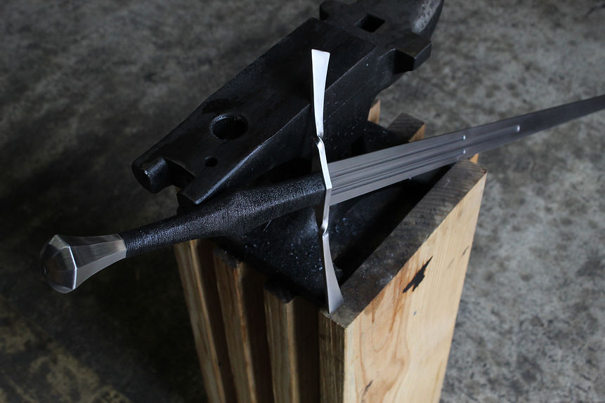 Longsword leaning on anvil