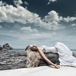 Woman lying on beach during Phuket photography session