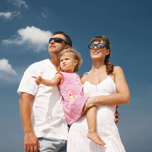 Parents and child during beach photoshoot in Phuket