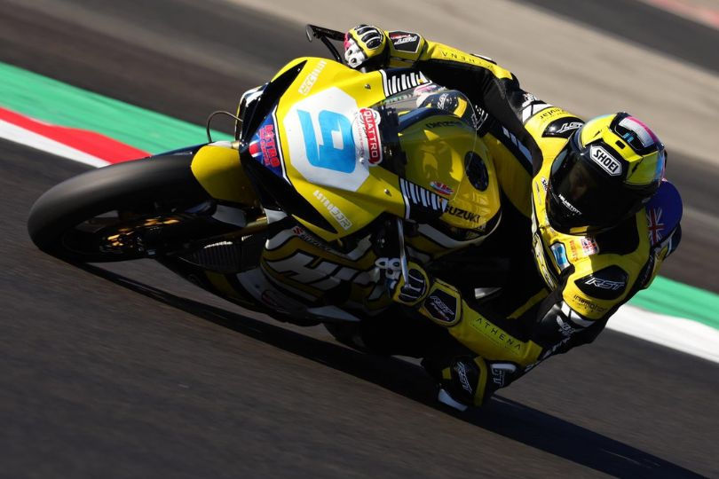 The late Shane Richardson, in action on his motorcycle wearing a yellow and black racing suit