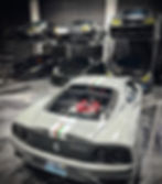 sport cars stacked on an OMER Bipark 2-post parking lift