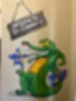 Pediatric dentist alligator mascot mural with 'Welcome to Dr. Cremer’s' sign at NRH Pediatric Dentistry in North Richland Hills, TX.