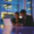 Business team collaborating on laptop