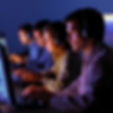 Team of people working intently on computers
