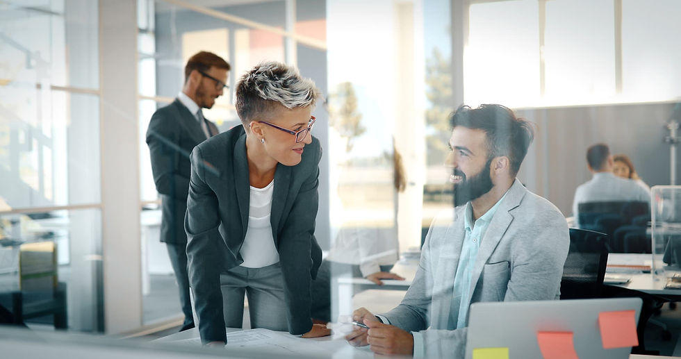 Business people in a modern office, discussing a project during the workday.