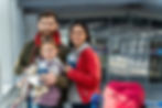 portrait-bearded-father-embracing-his-happy-daughter-while-his-wife-standing-nearby-family