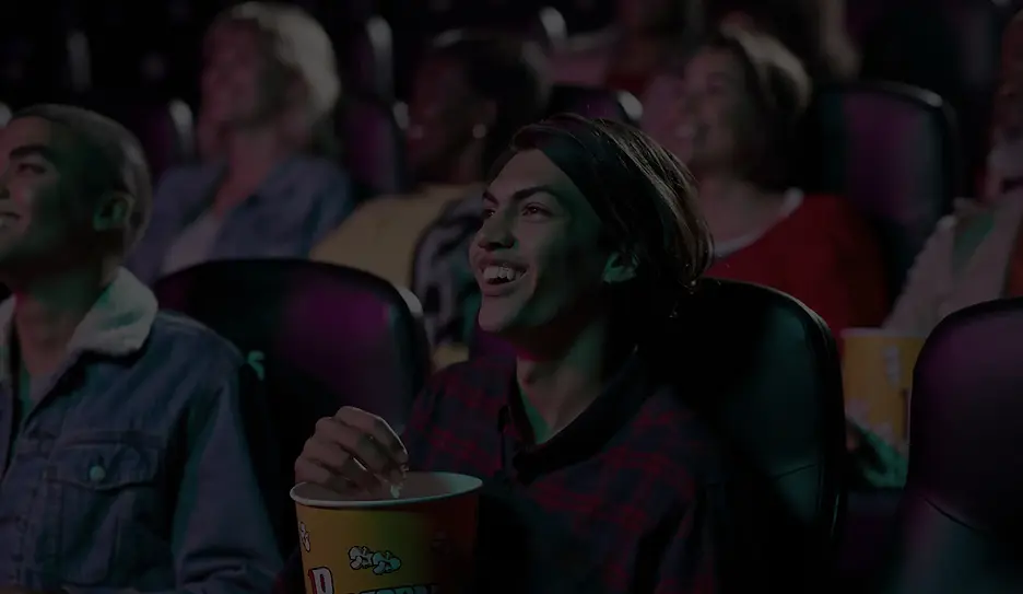 A crowd of people watching a movie