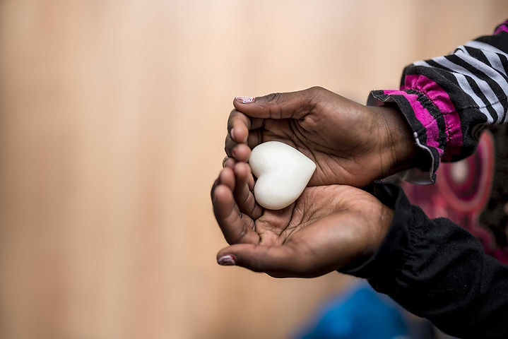 closeup-of-african-american-girl-holding-a-marble-2023-11-27-05-33-54-utc.jpg
