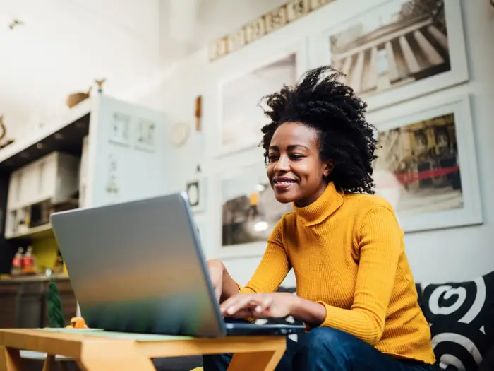 Woman Working on Laptop | Why Quantuvos?