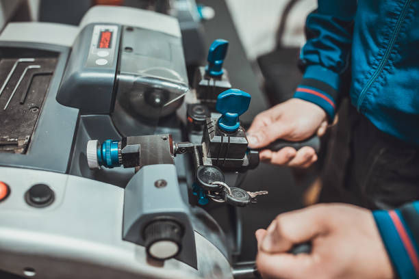Close-up of key cutting machine in use