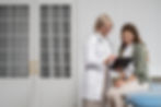 medium-shot-smiley-doctor-patient-chatting.jpg