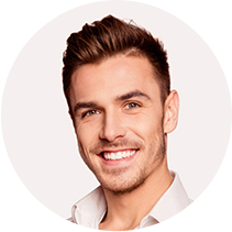 Smiling male client in a white shirt, representing satisfied customer testimonial.