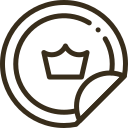 Gold circular sticker icon with a crown, symbolizing premium quality and excellence in hair care products or services.