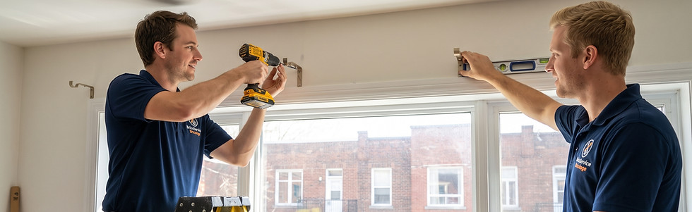 Handyman installing a curtain rod and window blinds above a window in a Montreal home