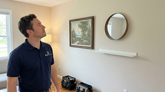 Handyman_inspecting_wall_items_20261004185035.jpg