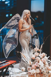 Elle Enchanted sings live in a glittering gown