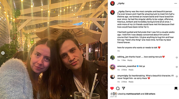 Danny Gallegos with his friend Hazel Rigby resting their heads on each other looking straight ahead into the camera in a restaurant