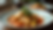 Eye-level view of a traditional Portuguese dish of bacalhau with potatoes and vegetables