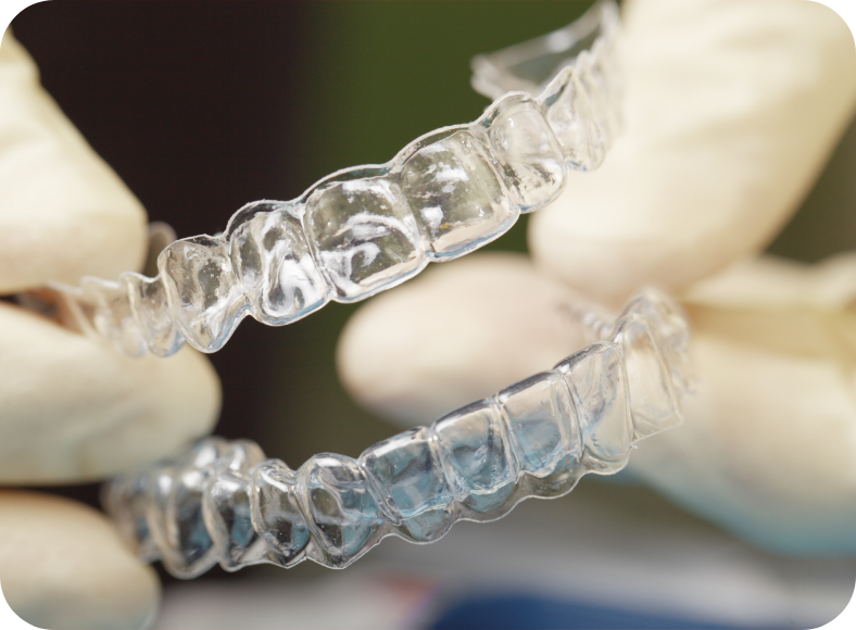 Close-up view of dental technician working on a dental crown