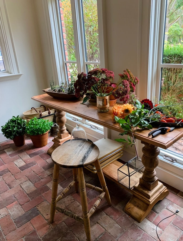 clean brick flooring with a table and decorations.
