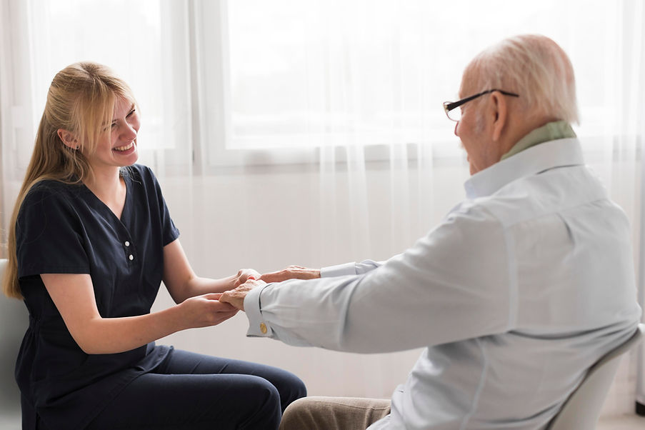 side-view-nurse-holding-senior-man-s-hands(1).jpg