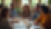 High angle view of a community meeting with diverse members discussing outreach strategies