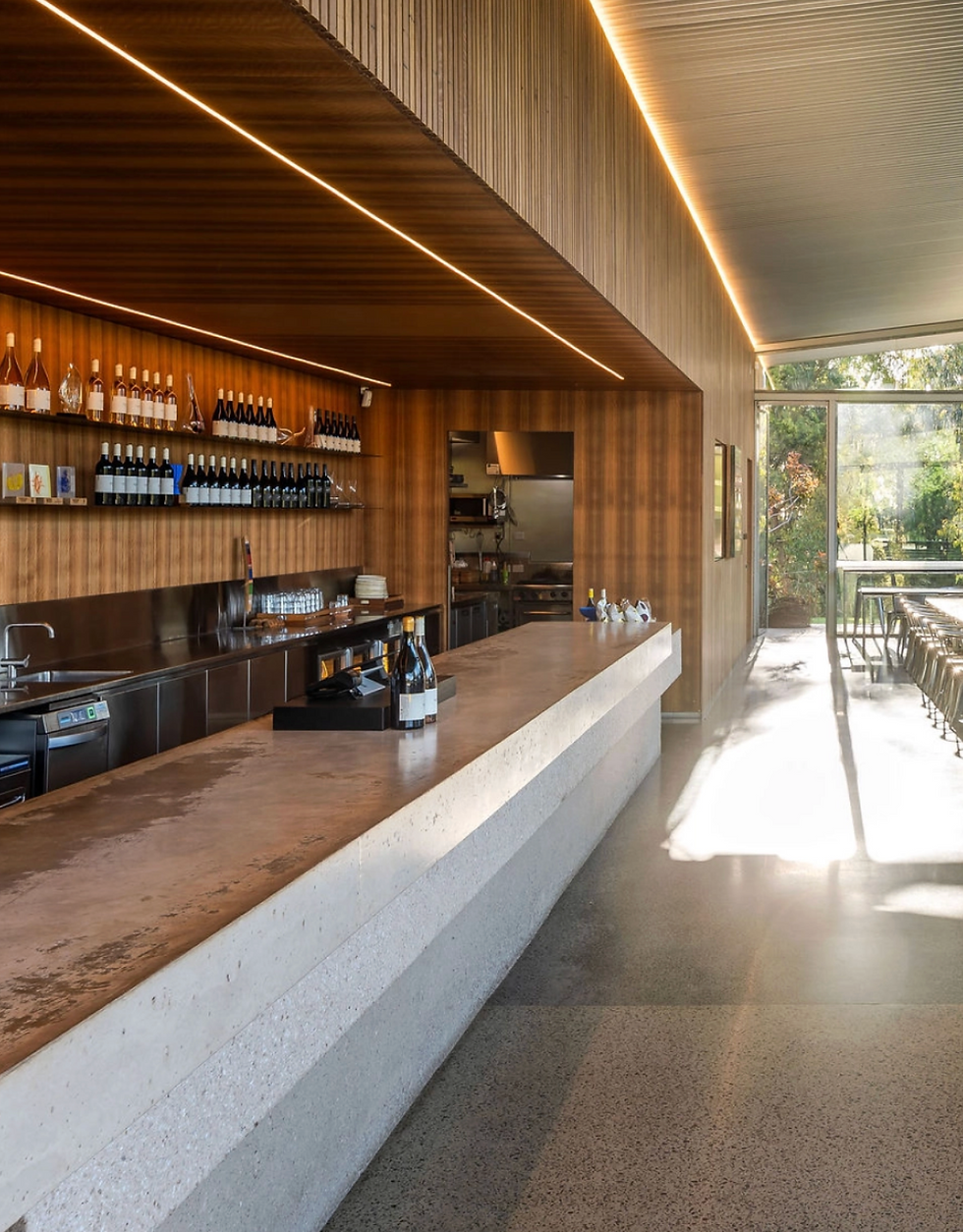 Modern winery cellar door with timber interiors, tasting bar and natural light in the Yarra Valley.