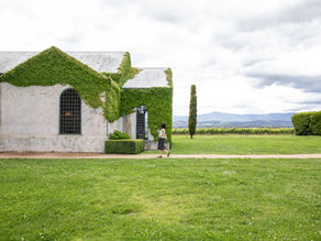person walking along path towards chapel