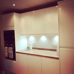 White handless Benchmark kitchen