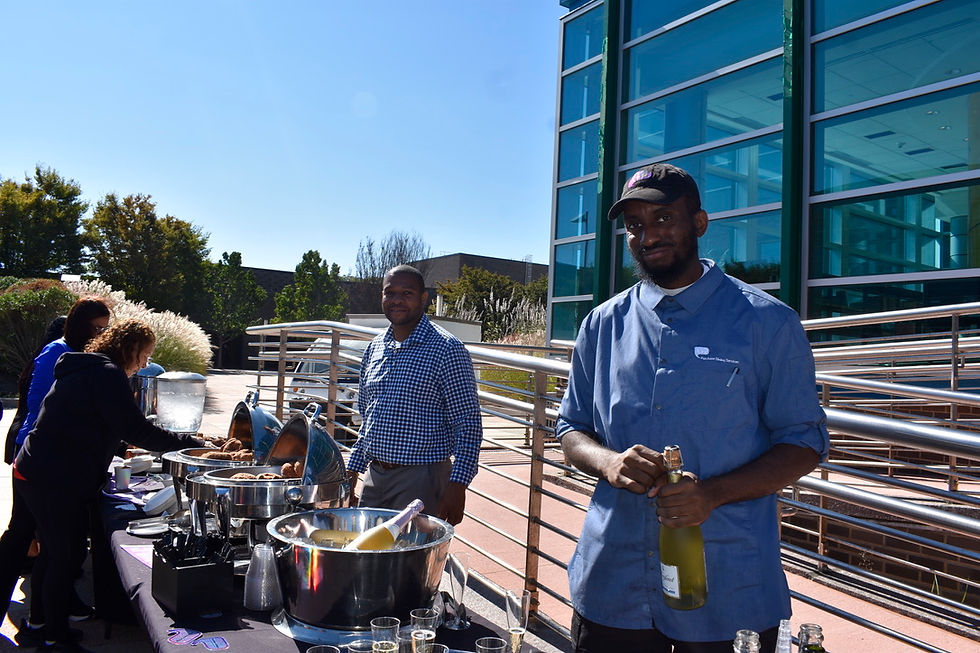 Osbourne Hoilett and dining worker served donuts and sparkling cider. (Photo by Sophia Pallozzi)